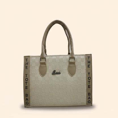 Beige tote bag with 'Guess' branding on a beige background