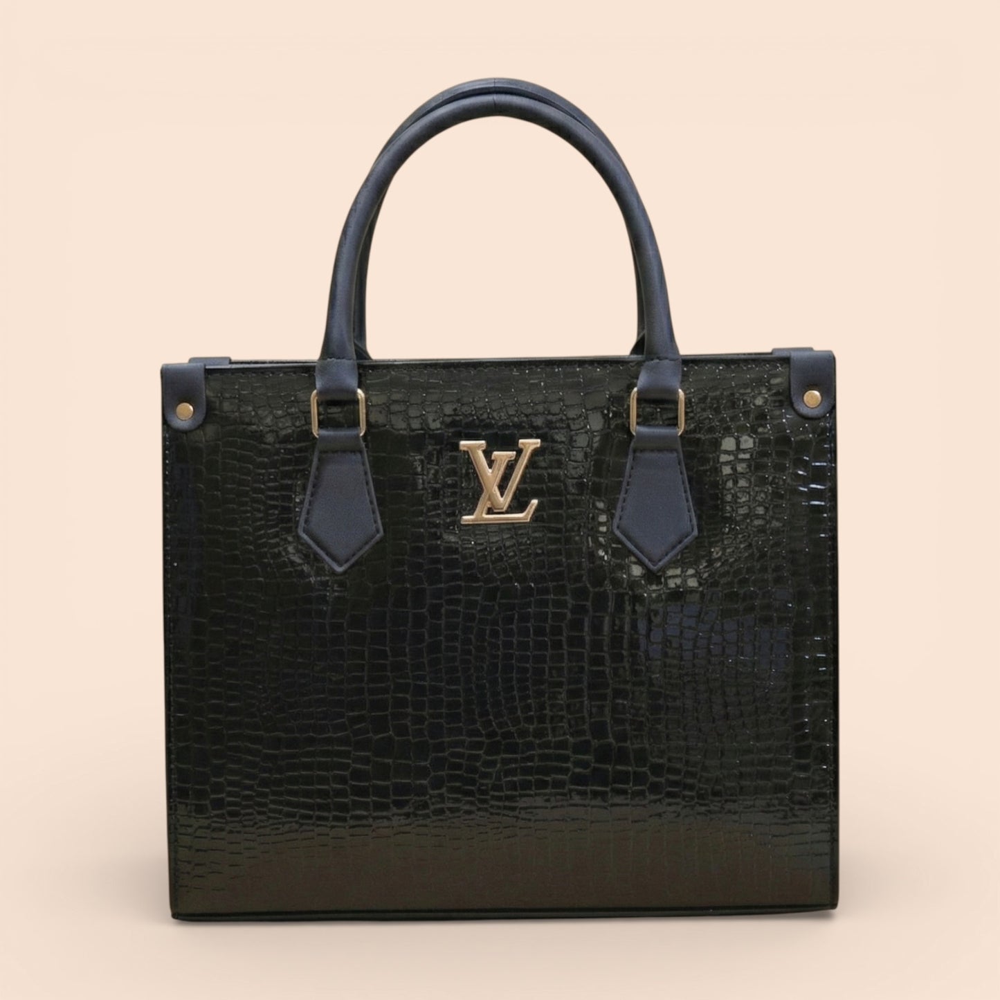 Black textured handbag with gold logo on a beige background