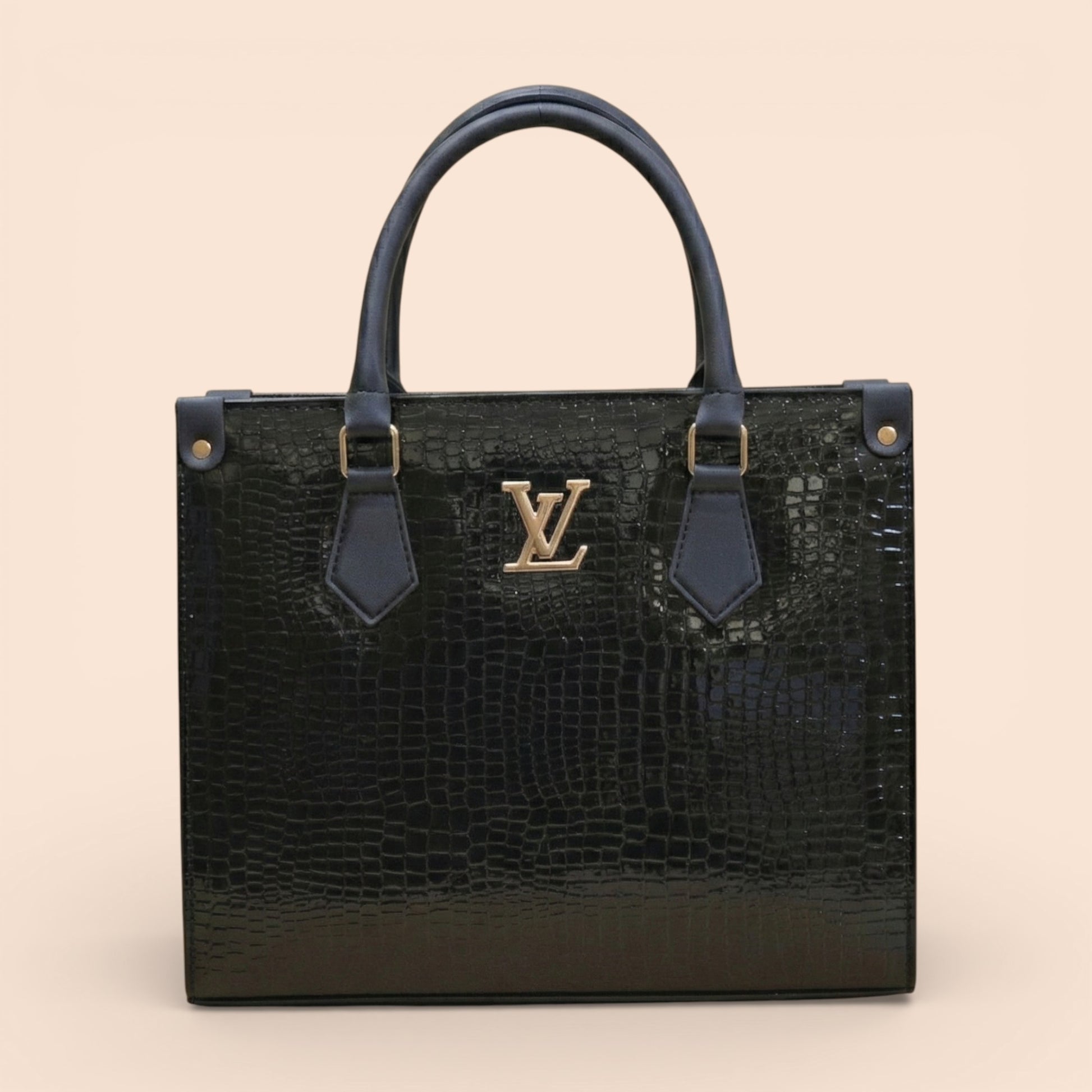 Black textured handbag with gold logo on a beige background