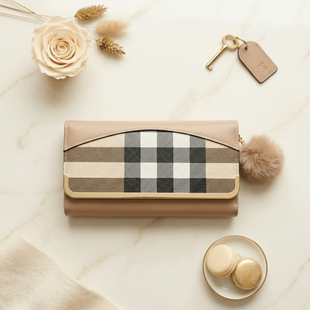 Beige handbag with plaid pattern on a light surface with decorative elements