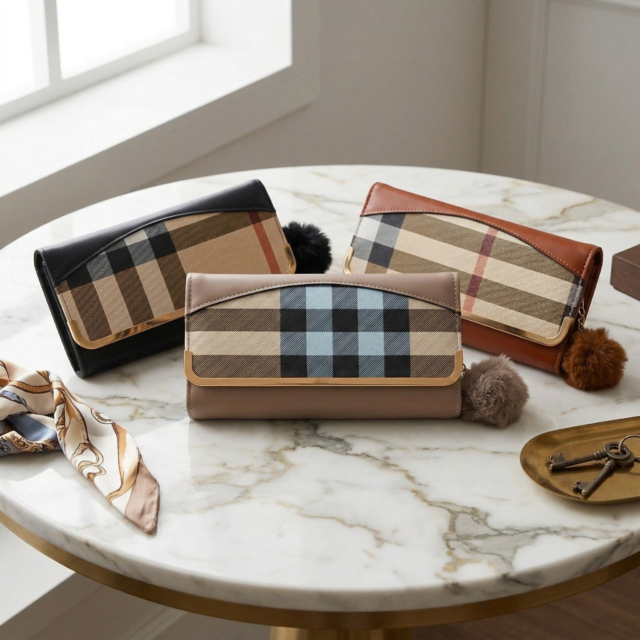 Three plaid patterned handbags on a marble table