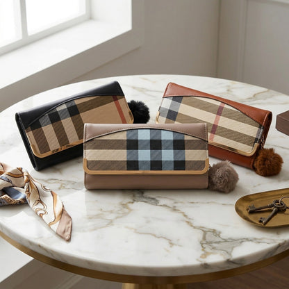 Three plaid patterned handbags on a marble table
